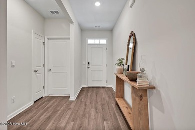 Easy living in this one level home with lawncare included! This on Cape Fear National At Brunswick Forest in North Carolina - for sale on GolfHomes.com, golf home, golf lot