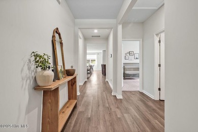 Easy living in this one level home with lawncare included! This on Cape Fear National At Brunswick Forest in North Carolina - for sale on GolfHomes.com, golf home, golf lot