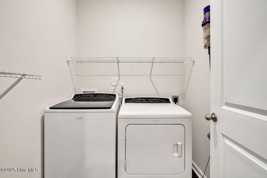 Easy living in this one level home with lawncare included! This on Cape Fear National At Brunswick Forest in North Carolina - for sale on GolfHomes.com, golf home, golf lot