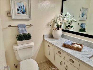 This elegant 2 bedroom one bathroom home is located in a serene on Leisure World Seal Beach Golf Course in California - for sale on GolfHomes.com, golf home, golf lot