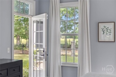 Experience luxury living in this stunning custom-built home on Savannah Quarters Country Club in Georgia - for sale on GolfHomes.com, golf home, golf lot