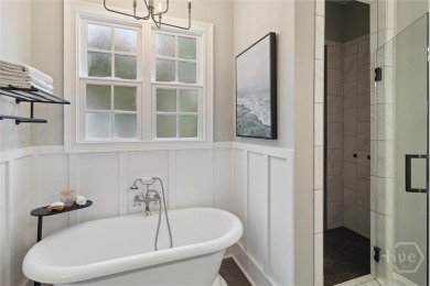Experience luxury living in this stunning custom-built home on Savannah Quarters Country Club in Georgia - for sale on GolfHomes.com, golf home, golf lot