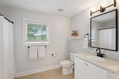 Experience luxury living in this stunning custom-built home on Savannah Quarters Country Club in Georgia - for sale on GolfHomes.com, golf home, golf lot