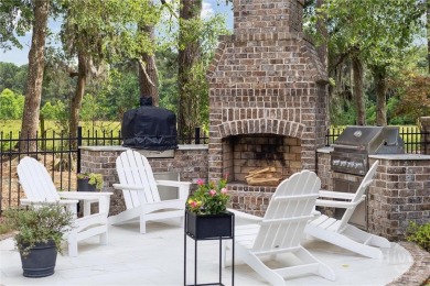 Experience luxury living in this stunning custom-built home on Savannah Quarters Country Club in Georgia - for sale on GolfHomes.com, golf home, golf lot