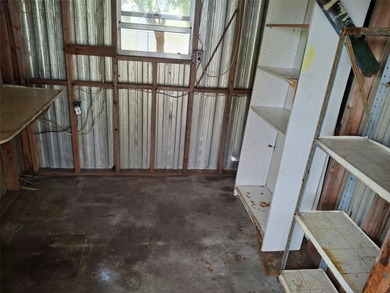 What a deal! Corner lot home with huge screened patio and on Barefoot Bay Golf Course in Florida - for sale on GolfHomes.com, golf home, golf lot