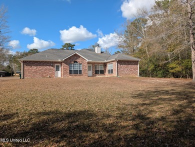 This home is located within a highly walkable community on Diamondhead Country Club in Mississippi - for sale on GolfHomes.com, golf home, golf lot