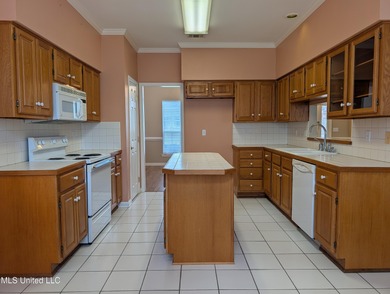 This home is located within a highly walkable community on Diamondhead Country Club in Mississippi - for sale on GolfHomes.com, golf home, golf lot