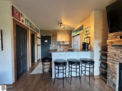 Fully furnished corner unit at the Lodge at Cedar River Village on Cedar River Golf Course in Michigan - for sale on GolfHomes.com, golf home, golf lot