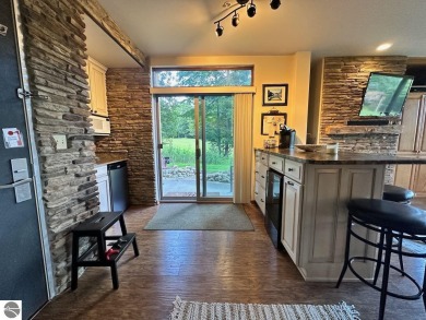 Fully furnished corner unit at the Lodge at Cedar River Village on Cedar River Golf Course in Michigan - for sale on GolfHomes.com, golf home, golf lot