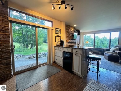 Fully furnished corner unit at the Lodge at Cedar River Village on Cedar River Golf Course in Michigan - for sale on GolfHomes.com, golf home, golf lot