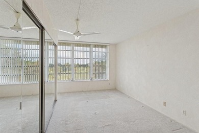 Located on the prestigious Oaks Clubhouse Drive in Palm-Aire on Palm-Aire Country Club and Resort - Palms in Florida - for sale on GolfHomes.com, golf home, golf lot