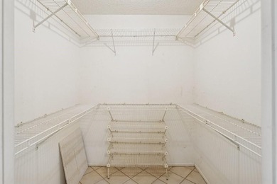 Located on the prestigious Oaks Clubhouse Drive in Palm-Aire on Palm-Aire Country Club and Resort - Palms in Florida - for sale on GolfHomes.com, golf home, golf lot