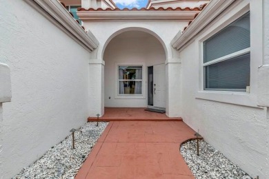 This spacious 4 bedroom, 2 and a half bath townhome is situated on The Boca Country Club in Florida - for sale on GolfHomes.com, golf home, golf lot