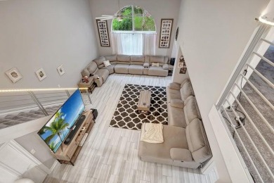 This spacious 4 bedroom, 2 and a half bath townhome is situated on The Boca Country Club in Florida - for sale on GolfHomes.com, golf home, golf lot