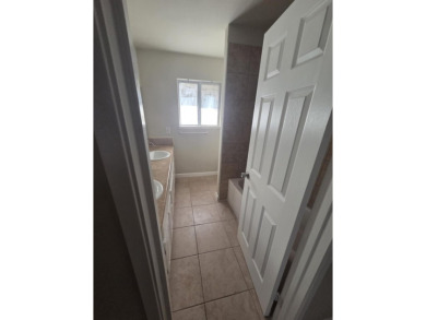Remodeled 3 bedroom 2 bathroom house, new flooring throughout on Tierra Del Sol Golf Course in California - for sale on GolfHomes.com, golf home, golf lot