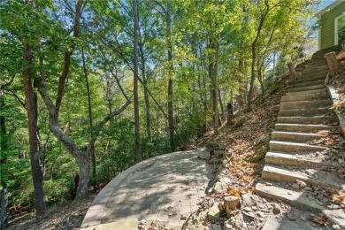 Lakeview Cottage Retreat on Wooded Lot Overlooking a Flowing on The Highlands Course at Lake Arrowhead in Georgia - for sale on GolfHomes.com, golf home, golf lot