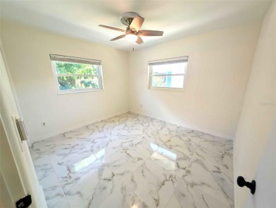 NO FLOOD ZONE-- Move-in ready with major upgrades already on St. Petersburg Country Club in Florida - for sale on GolfHomes.com, golf home, golf lot