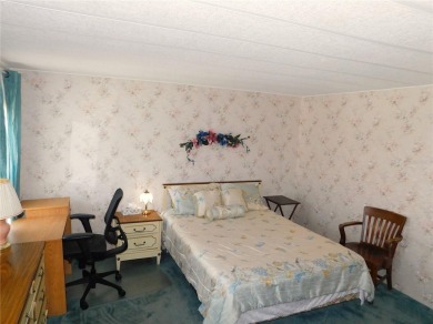 This charming, fully furnished home is perfect for both relaxing on Betmar Acres Golf Club in Florida - for sale on GolfHomes.com, golf home, golf lot