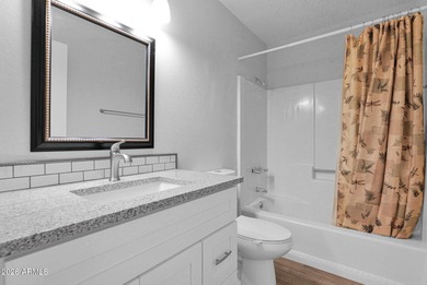 Welcome home to effortless living in Fountain of the Sun, a on Fountain of the Sun Country Club in Arizona - for sale on GolfHomes.com, golf home, golf lot