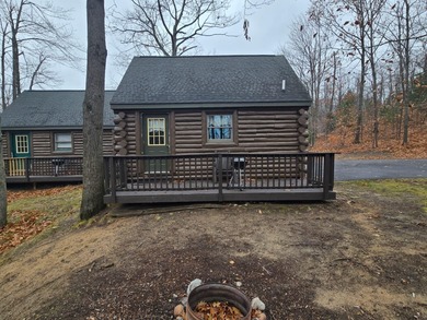 Charming and cozy, this Beaver Creek Resort cabin offers the on The Loon Golf Resort in Michigan - for sale on GolfHomes.com, golf home, golf lot