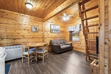 Charming and cozy, this Beaver Creek Resort cabin offers the on The Loon Golf Resort in Michigan - for sale on GolfHomes.com, golf home, golf lot