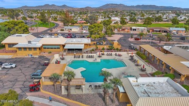 Welcome home to effortless living in Fountain of the Sun, a on Fountain of the Sun Country Club in Arizona - for sale on GolfHomes.com, golf home, golf lot