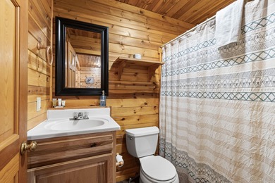 Charming and cozy, this Beaver Creek Resort cabin offers the on The Loon Golf Resort in Michigan - for sale on GolfHomes.com, golf home, golf lot