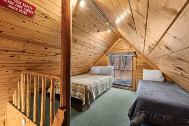 Charming and cozy, this Beaver Creek Resort cabin offers the on The Loon Golf Resort in Michigan - for sale on GolfHomes.com, golf home, golf lot