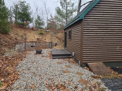 Adorable and inviting, this 2-bedroom, 1-bath Beaver Creek cabin on The Loon Golf Resort in Michigan - for sale on GolfHomes.com, golf home, golf lot