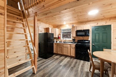 Adorable and inviting, this 2-bedroom, 1-bath Beaver Creek cabin on The Loon Golf Resort in Michigan - for sale on GolfHomes.com, golf home, golf lot
