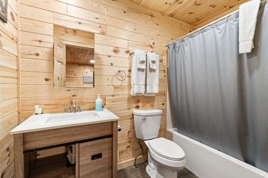 Adorable and inviting, this 2-bedroom, 1-bath Beaver Creek cabin on The Loon Golf Resort in Michigan - for sale on GolfHomes.com, golf home, golf lot