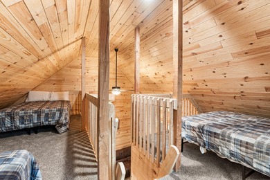 Adorable and inviting, this 2-bedroom, 1-bath Beaver Creek cabin on The Loon Golf Resort in Michigan - for sale on GolfHomes.com, golf home, golf lot
