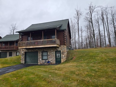 Discover this inviting Beaver Creek Resort cabin, offering the on The Loon Golf Resort in Michigan - for sale on GolfHomes.com, golf home, golf lot