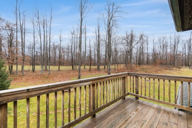 Discover this inviting Beaver Creek Resort cabin, offering the on The Loon Golf Resort in Michigan - for sale on GolfHomes.com, golf home, golf lot