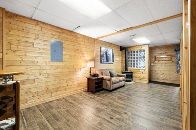 Discover this inviting Beaver Creek Resort cabin, offering the on The Loon Golf Resort in Michigan - for sale on GolfHomes.com, golf home, golf lot