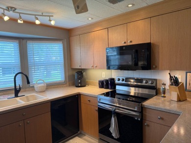 This lovely, manufacture home is on leased land in Lake Fairways on Pine Lakes Country Club in Florida - for sale on GolfHomes.com, golf home, golf lot