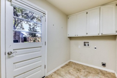 This 3-bedroom, 2-bathroom home is nestled in the highly coveted on Pecan Plantation Country Club in Texas - for sale on GolfHomes.com, golf home, golf lot