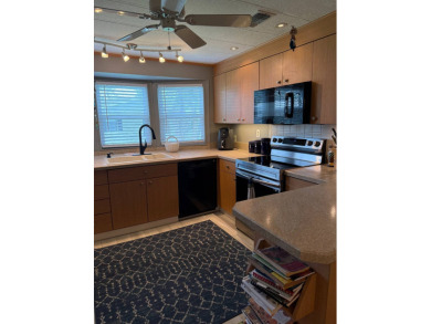 This lovely, manufacture home is on leased land in Lake Fairways on Pine Lakes Country Club in Florida - for sale on GolfHomes.com, golf home, golf lot