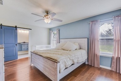 This 3-bedroom, 2-bathroom home is nestled in the highly coveted on Pecan Plantation Country Club in Texas - for sale on GolfHomes.com, golf home, golf lot