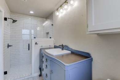 This 3-bedroom, 2-bathroom home is nestled in the highly coveted on Pecan Plantation Country Club in Texas - for sale on GolfHomes.com, golf home, golf lot