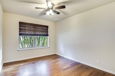 This 3-bedroom, 2-bathroom home is nestled in the highly coveted on Pecan Plantation Country Club in Texas - for sale on GolfHomes.com, golf home, golf lot