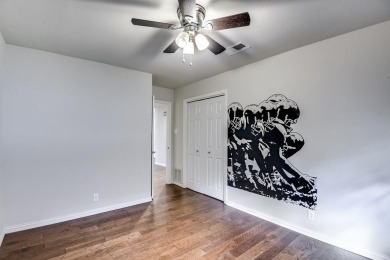 This 3-bedroom, 2-bathroom home is nestled in the highly coveted on Pecan Plantation Country Club in Texas - for sale on GolfHomes.com, golf home, golf lot