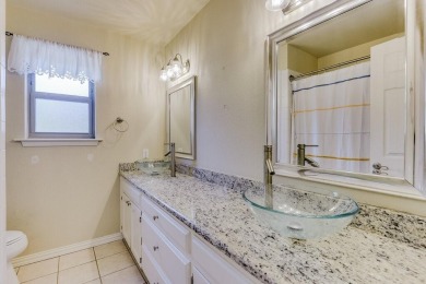 This 3-bedroom, 2-bathroom home is nestled in the highly coveted on Pecan Plantation Country Club in Texas - for sale on GolfHomes.com, golf home, golf lot