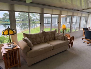 This lovely, manufacture home is on leased land in Lake Fairways on Pine Lakes Country Club in Florida - for sale on GolfHomes.com, golf home, golf lot