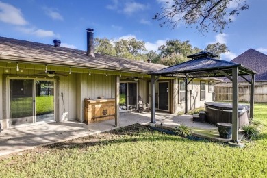 This 3-bedroom, 2-bathroom home is nestled in the highly coveted on Pecan Plantation Country Club in Texas - for sale on GolfHomes.com, golf home, golf lot