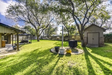 This 3-bedroom, 2-bathroom home is nestled in the highly coveted on Pecan Plantation Country Club in Texas - for sale on GolfHomes.com, golf home, golf lot