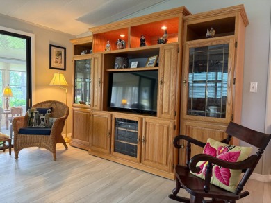 This lovely, manufacture home is on leased land in Lake Fairways on Pine Lakes Country Club in Florida - for sale on GolfHomes.com, golf home, golf lot