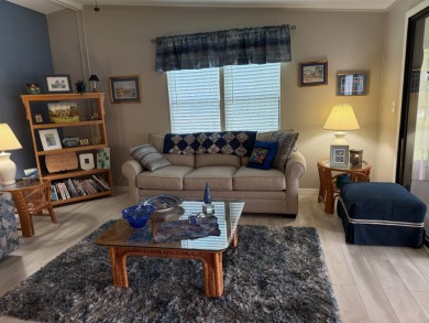 This lovely, manufacture home is on leased land in Lake Fairways on Pine Lakes Country Club in Florida - for sale on GolfHomes.com, golf home, golf lot