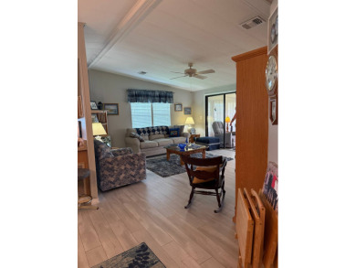 This lovely, manufacture home is on leased land in Lake Fairways on Pine Lakes Country Club in Florida - for sale on GolfHomes.com, golf home, golf lot