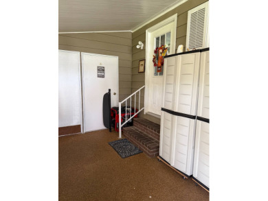 This lovely, manufacture home is on leased land in Lake Fairways on Pine Lakes Country Club in Florida - for sale on GolfHomes.com, golf home, golf lot